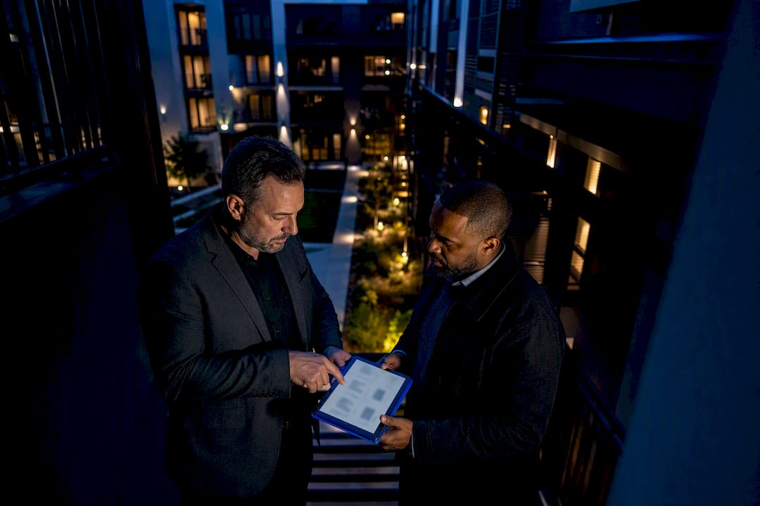 Investor and lender reviewing rental property metrics